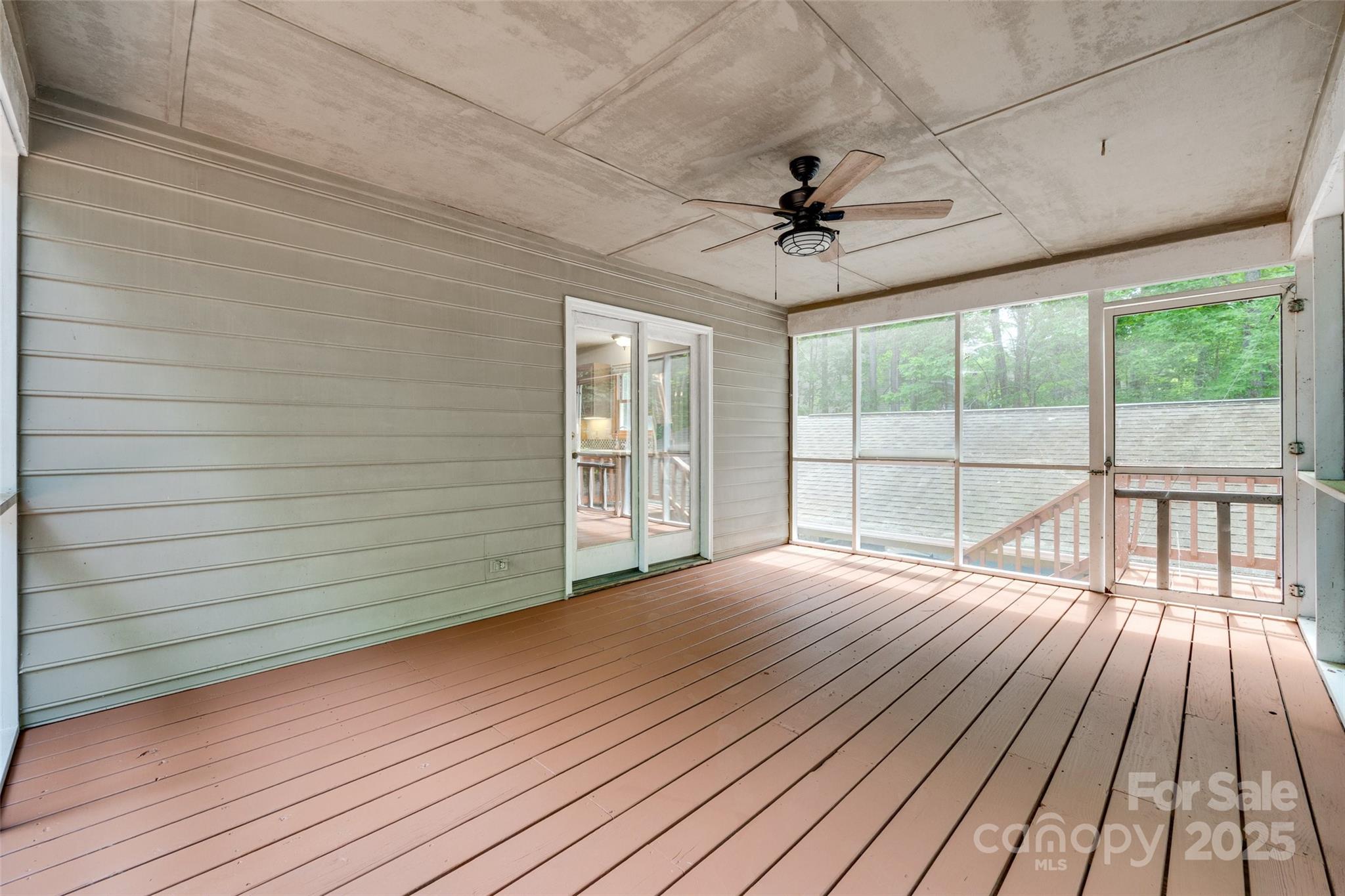 25056 Timberlake Drive Fort Mill, SC 29708 - Photo 11 of 37 a view of empty room with wooden floor and fan