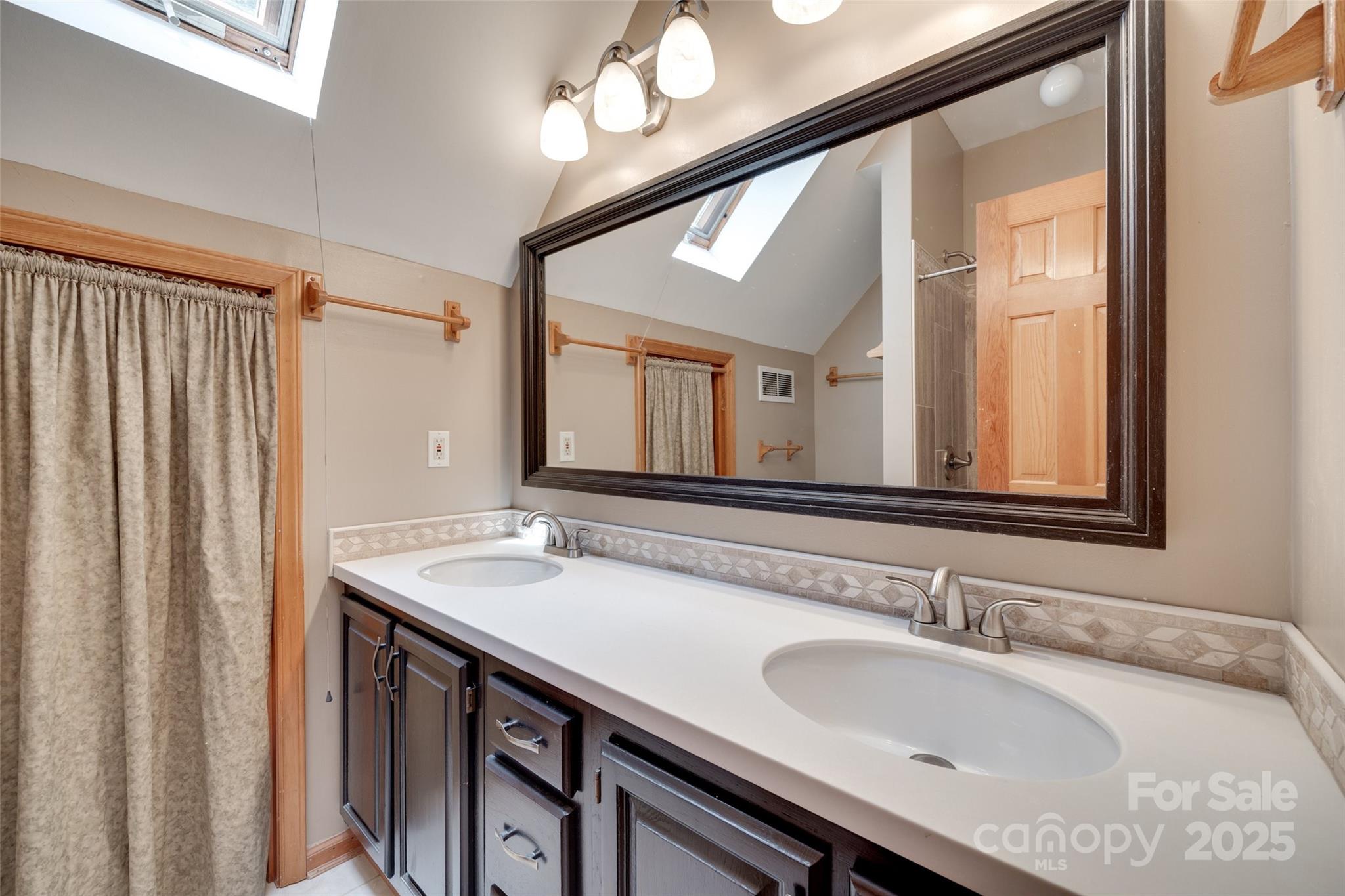25056 Timberlake Drive Fort Mill, SC 29708 - Photo 18 of 37 a bathroom with a granite countertop sink and a mirror