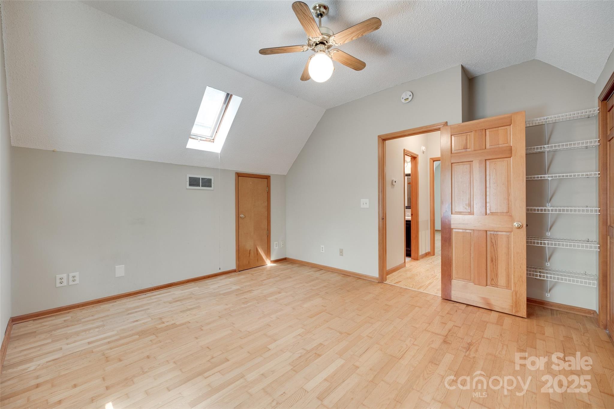 25056 Timberlake Drive Fort Mill, SC 29708 - Photo 19 of 37 an empty room with closet and a ceiling fan