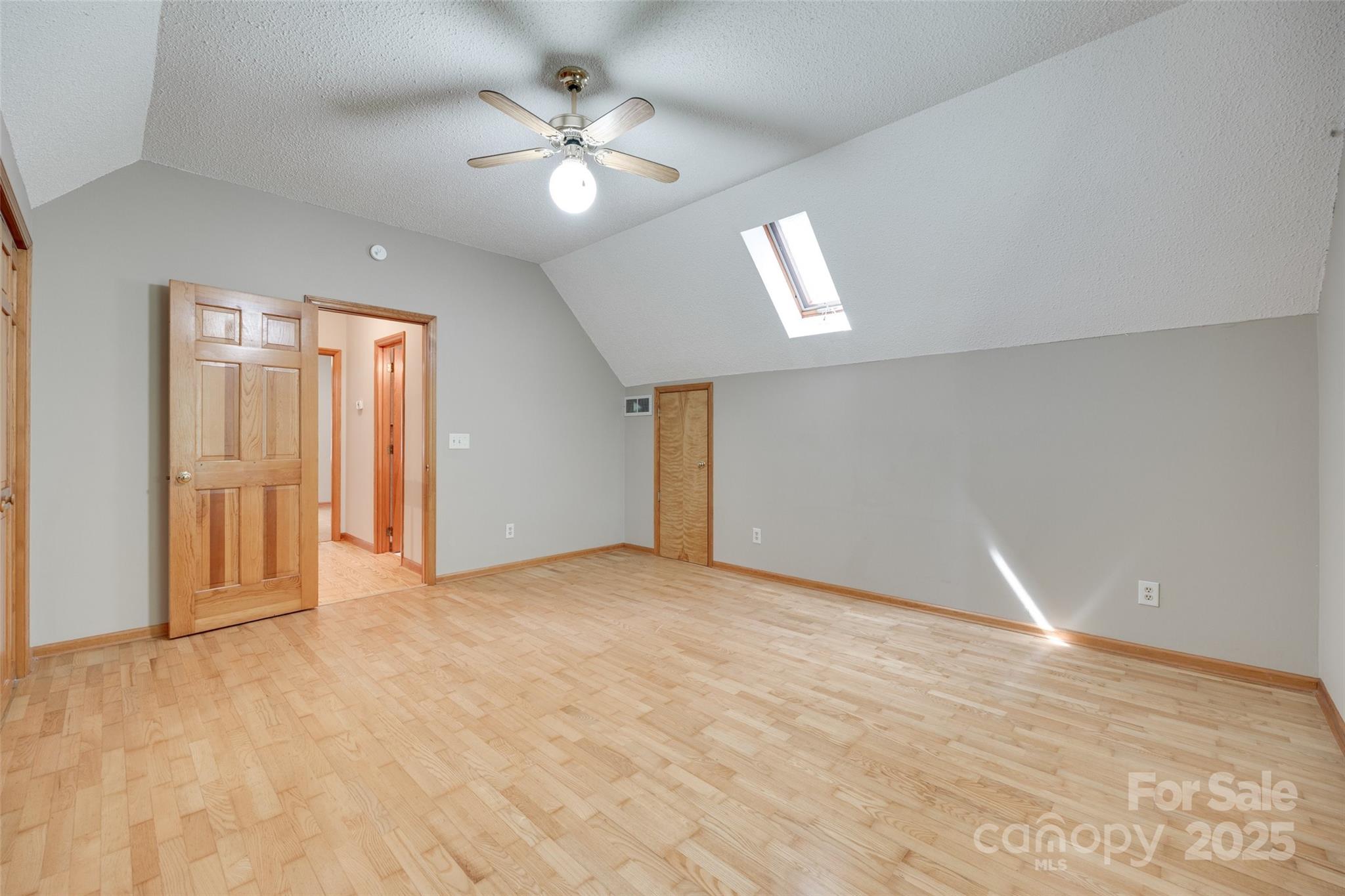 25056 Timberlake Drive Fort Mill, SC 29708 - Photo 21 of 37 an empty room with chandelier fan and windows