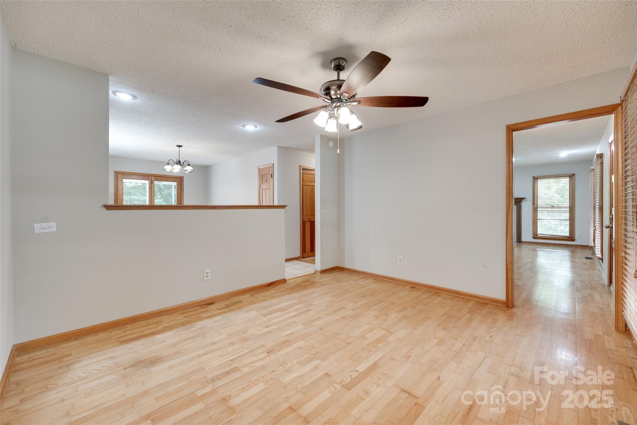 25056 Timberlake Drive Fort Mill, SC 29708 - Photo 29 of 37 a view of an empty room with window and wooden floor