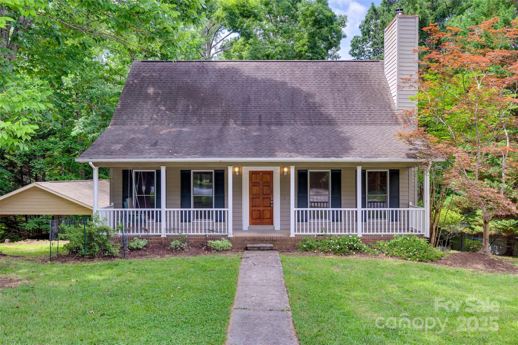 25056 Timberlake Drive Fort Mill, SC 29708 - Photo 6 of 37 a front view of a house with yard and garden