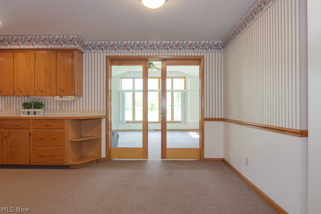 3185 Brenner Road Barberton, OH 44203 - Photo 1 of 3 Glass pocket doors sperate the kitchen and family room.