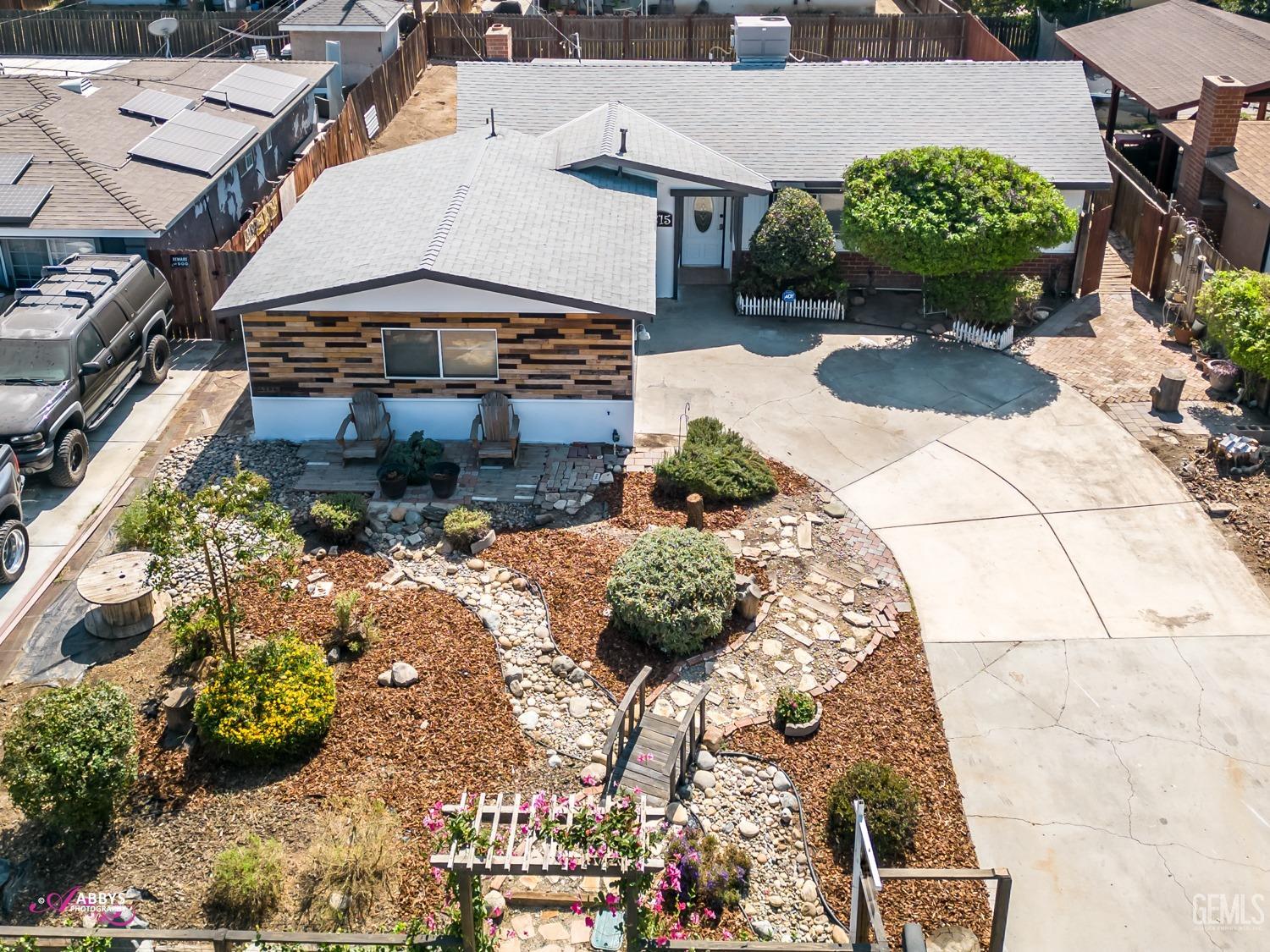 Undisclosed Address Bakersfield, CA 93309 - Photo 16 of 21 a view of a garden with potted plants
