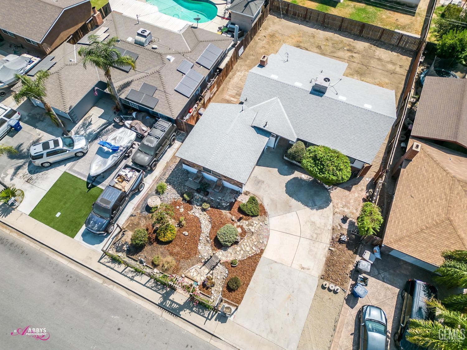 Undisclosed Address Bakersfield, CA 93309 - Photo 18 of 21 an aerial view of a house with a yard and garden