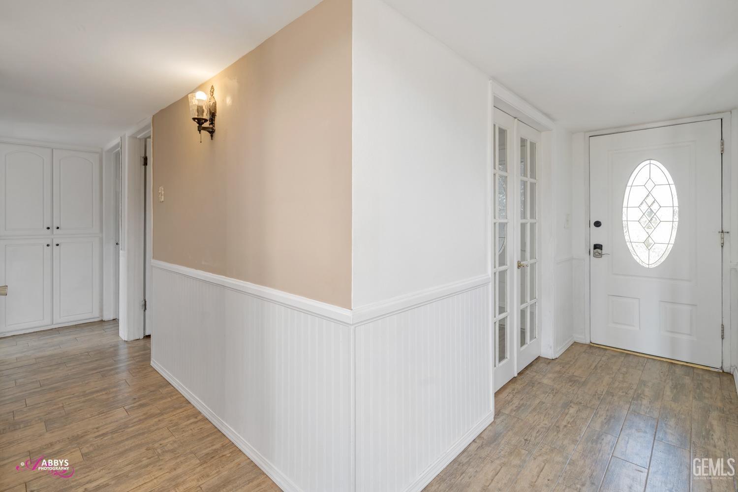 Undisclosed Address Bakersfield, CA 93309 - Photo 19 of 21 a view of a hallway with wooden floor