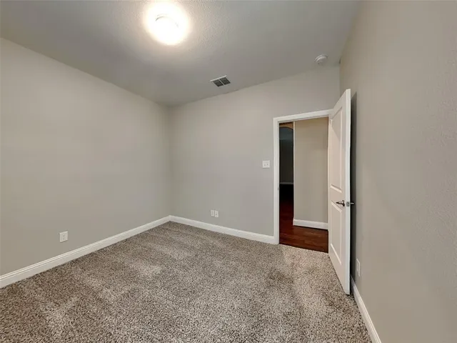 an empty room with an entryway