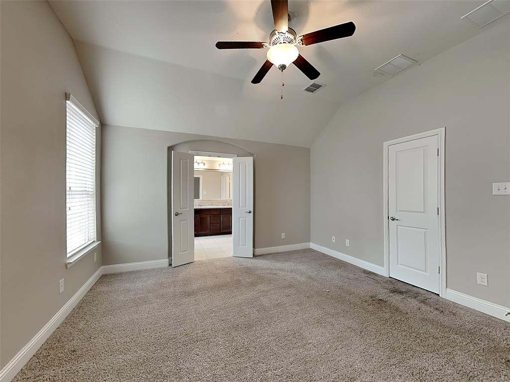 7248 Laguna Del Campo Trail Fort Worth, TX 76131 - Photo 7 of 15 an empty room with windows and fan