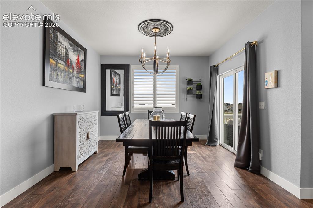 12781 Granite Ridge Drive Peyton, CO 80831 - Photo 14 of 41 The expansive dining space is perfect for evening dinners or entertaining.