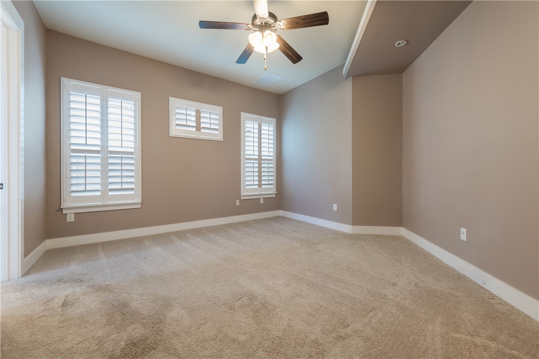7811 Wildcat Pass Austin, TX 78757 - Photo 9 of 24 an empty room with windows and fan