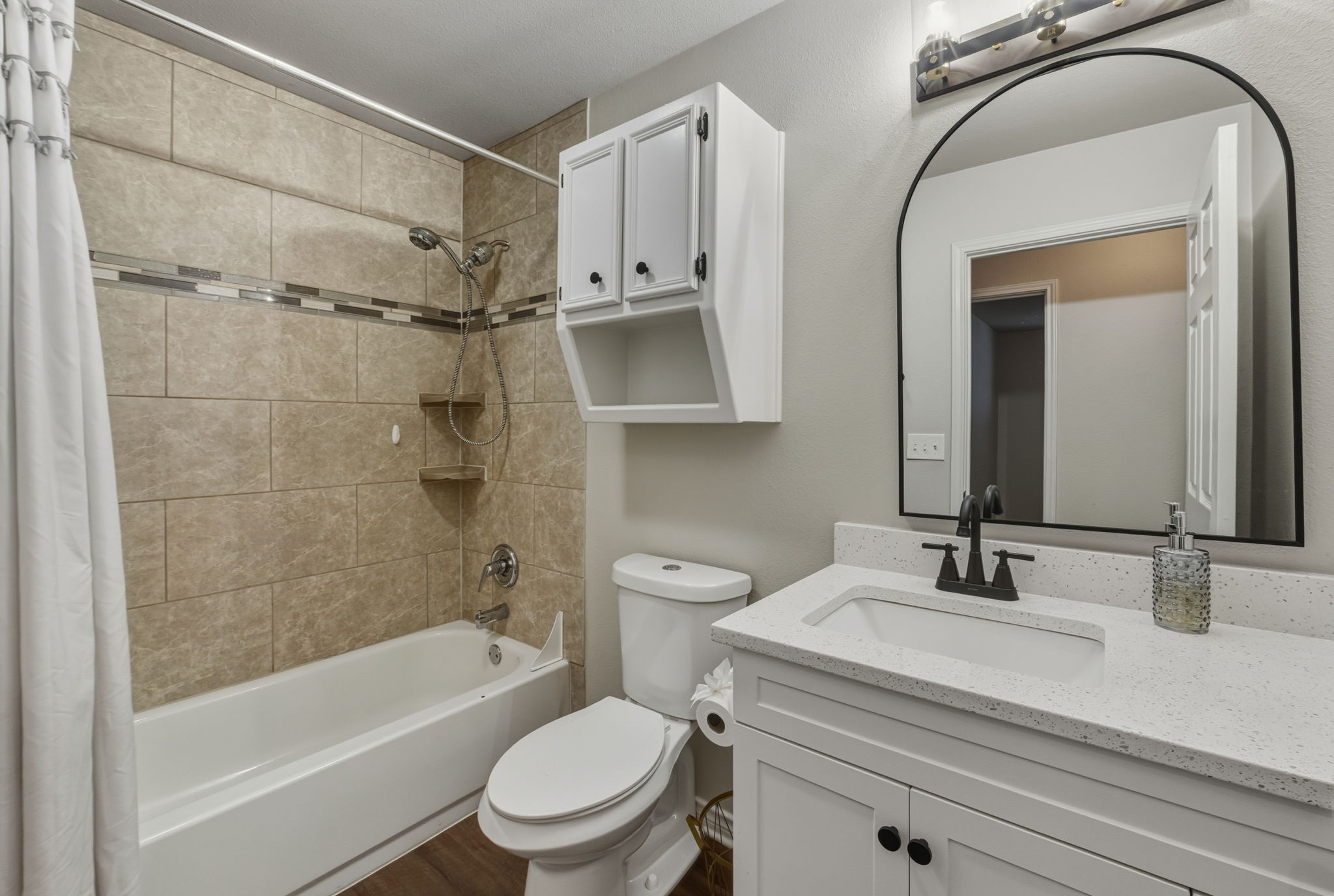 20808 Sandy Brown Lane Webberville, TX 78621 - Photo 30 of 40 Guest Bathroom with a Tub/Shower Combo. 3rd Full Bathroom