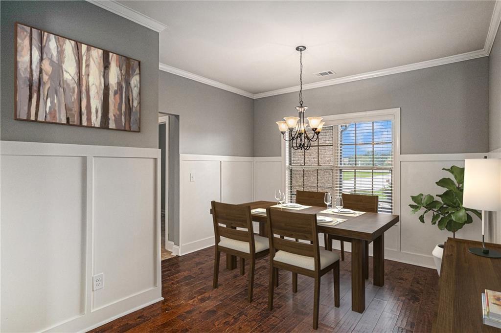 1120 Stroud Road McDonough, GA 30252 - Photo 3 of 6 a view of a dining room with furniture window and wooden floor