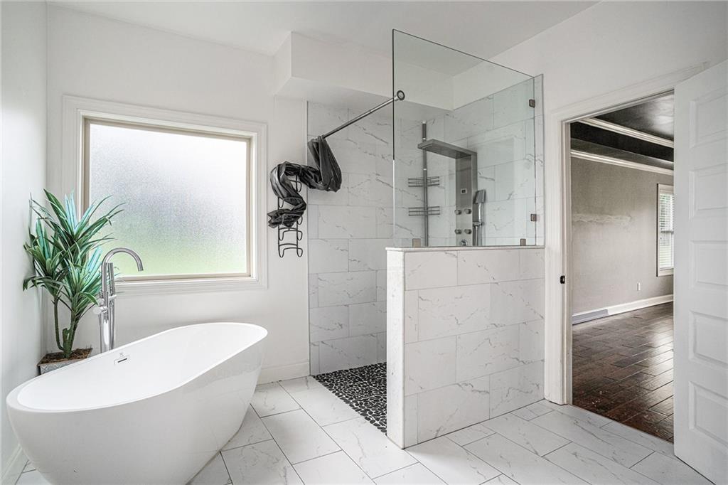 1120 Stroud Road McDonough, GA 30252 - Photo 5 of 6 a bathroom with a sink a toilet and shower