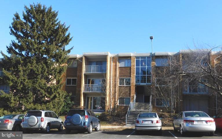 a view of a car parked in front of a buildings