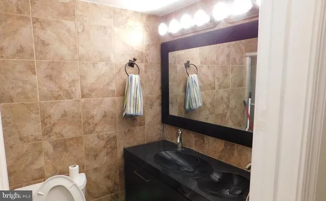 a bathroom with a bathtub and shower