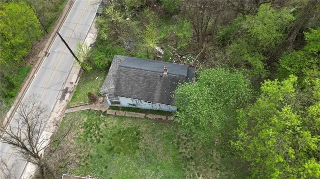 a backyard of a house with lots of green space