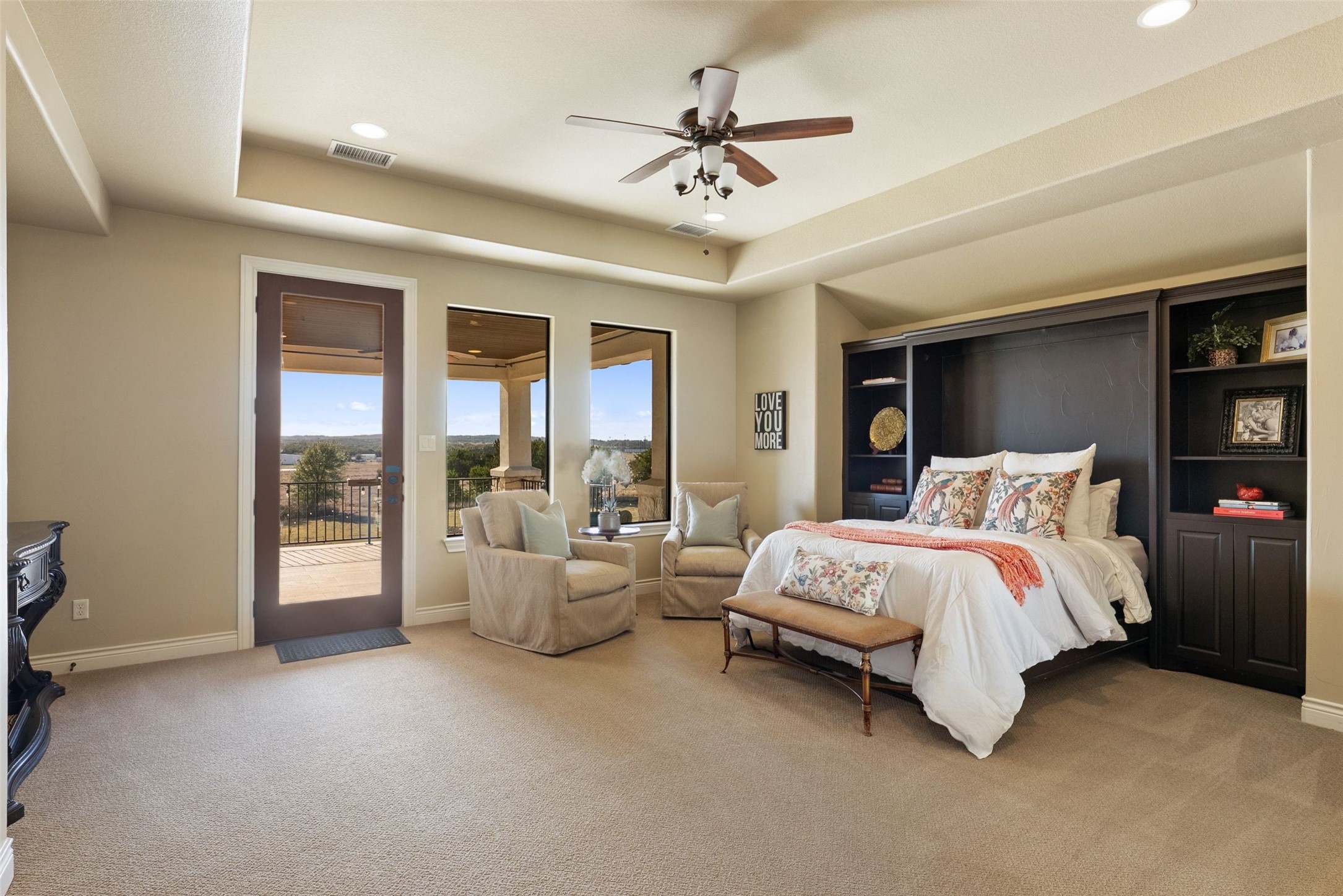 7220 Creek Road Dripping Springs, TX 78620 - Photo 14 of 40 Primary Bedroom #2 located upstairs with access to covered balcony/deck area.