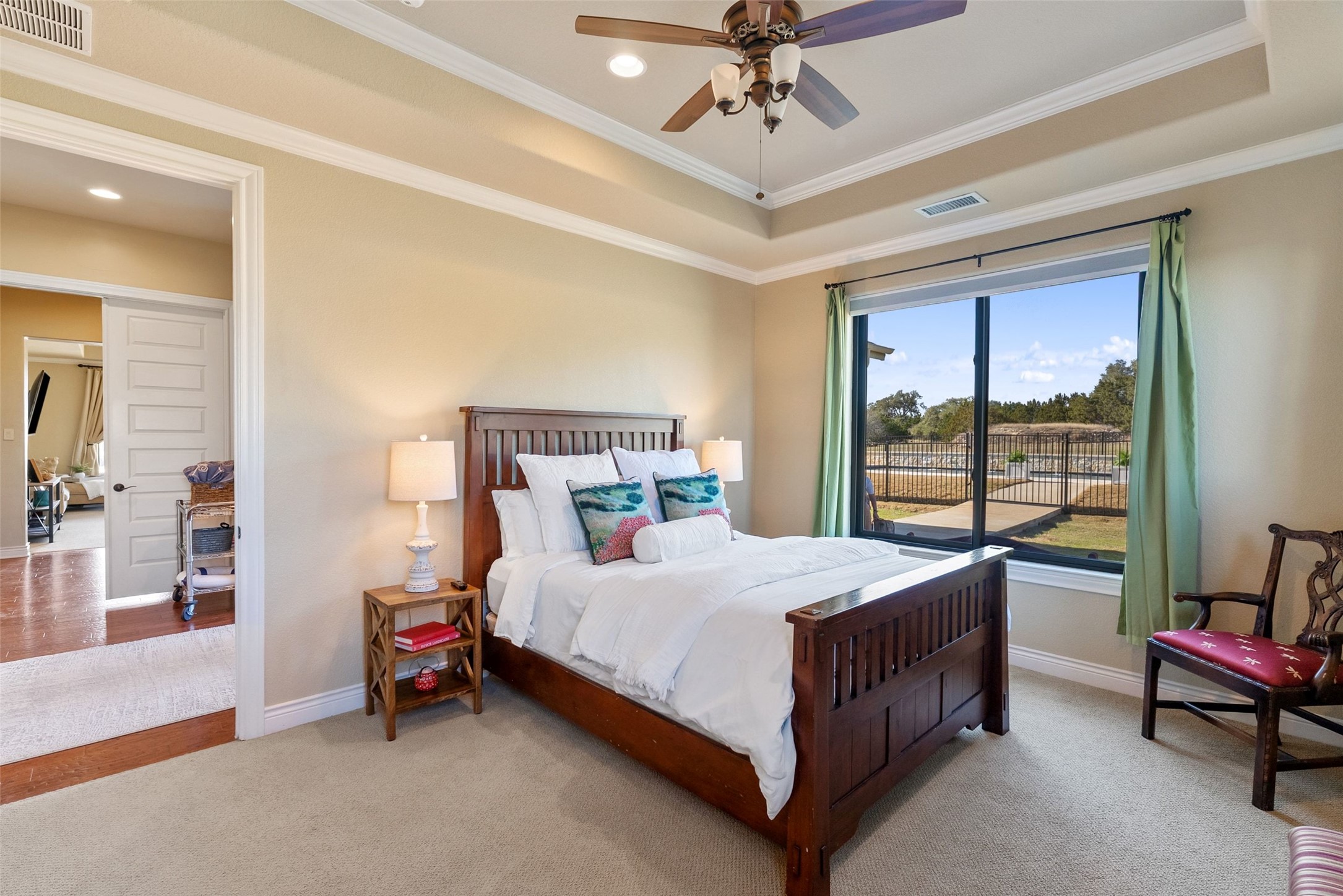 7220 Creek Road Dripping Springs, TX 78620 - Photo 20 of 40 Bedroom #4 located on the first level of the main house. Features an en-suite bathroom and a separate entrance.