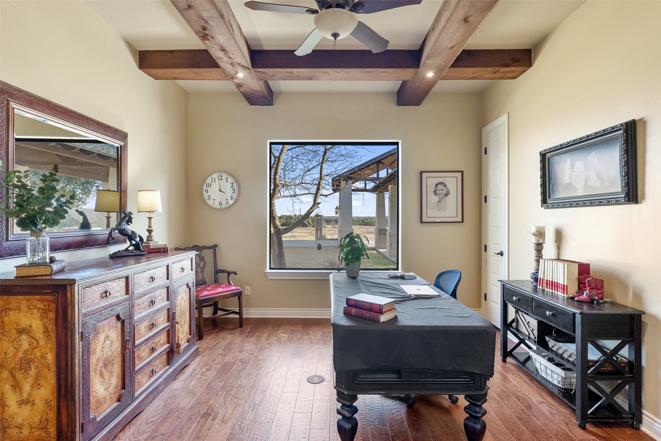 7220 Creek Road Dripping Springs, TX 78620 - Photo 21 of 40 a living room with furniture a fireplace and a window
