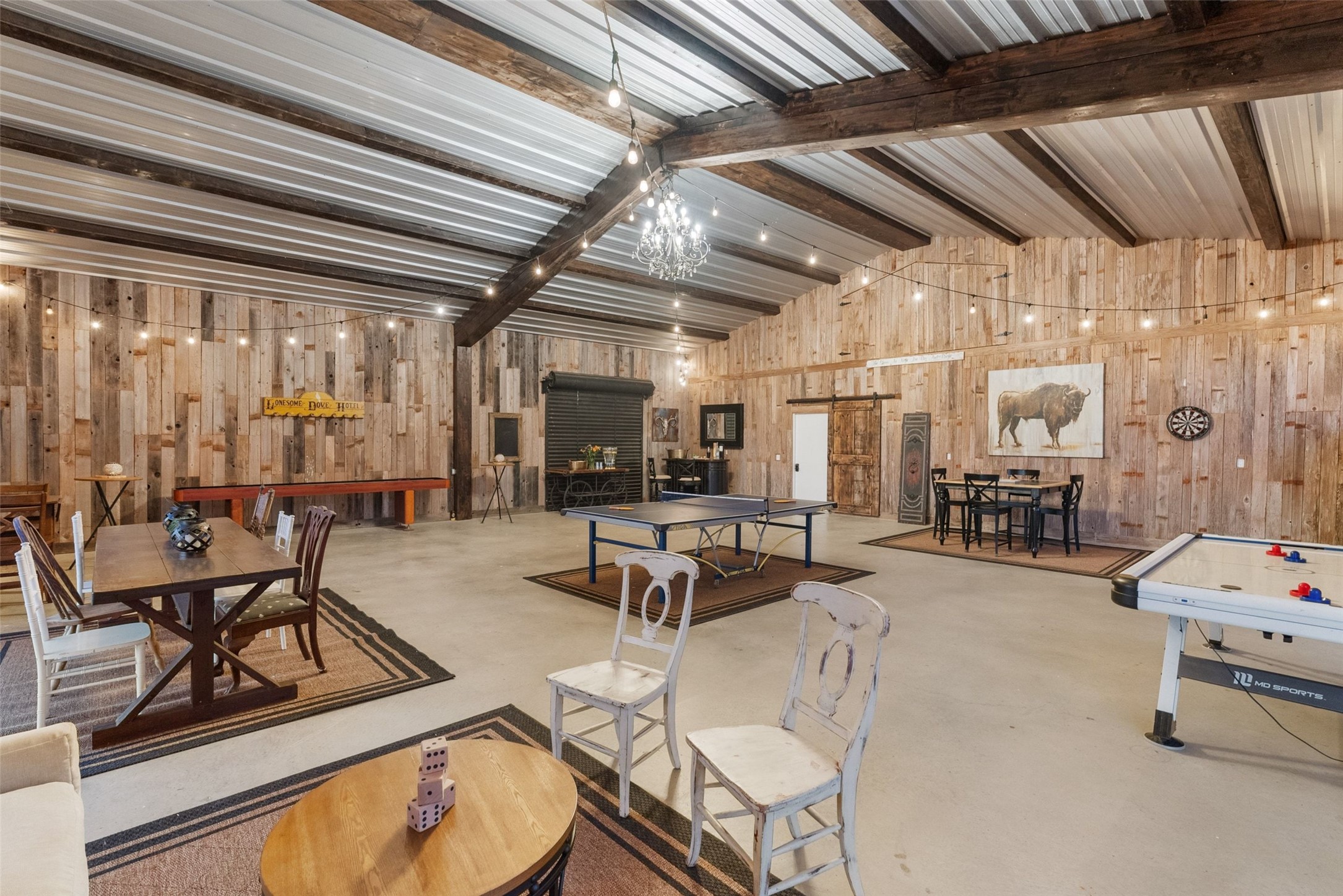 7220 Creek Road Dripping Springs, TX 78620 - Photo 24 of 40 a living room with furniture a table and chairs