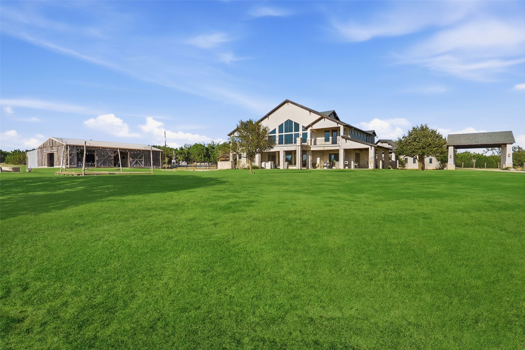 7220 Creek Road Dripping Springs, TX 78620 - Photo 29 of 40 a front view of a house with a yard