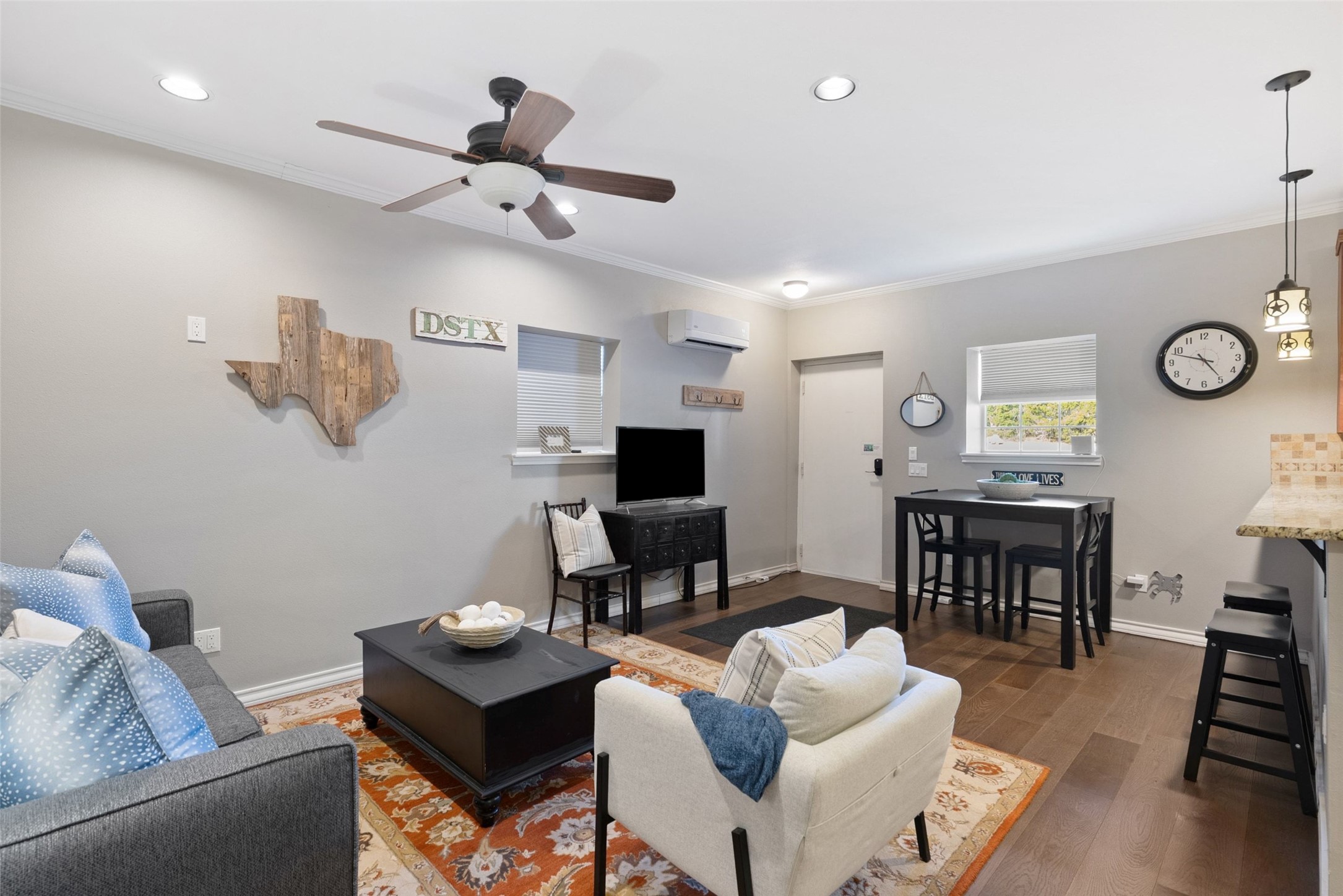 7220 Creek Road Dripping Springs, TX 78620 - Photo 31 of 40 a living room with furniture and a wooden floor
