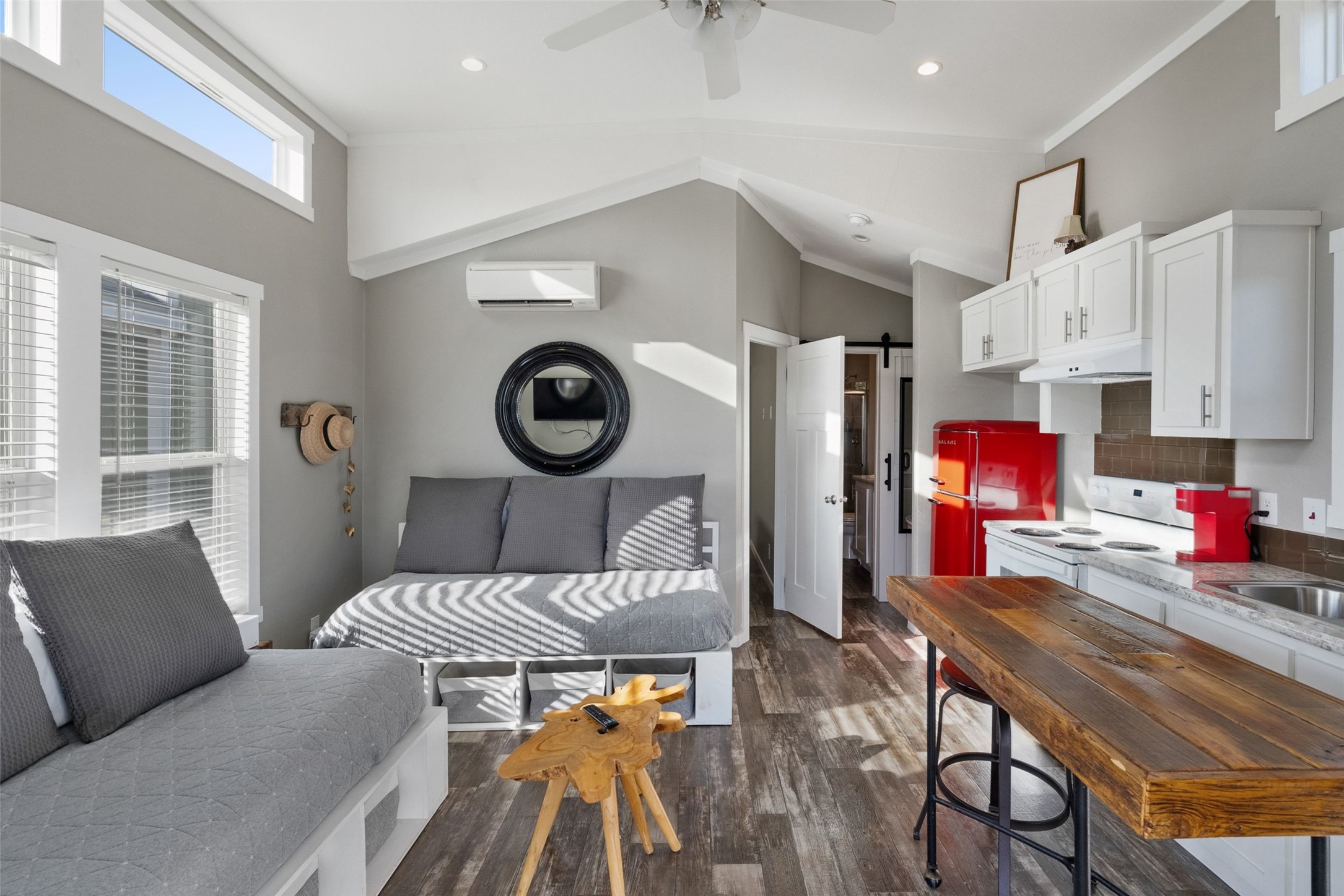 7220 Creek Road Dripping Springs, TX 78620 - Photo 34 of 40 a living room with furniture and a clock