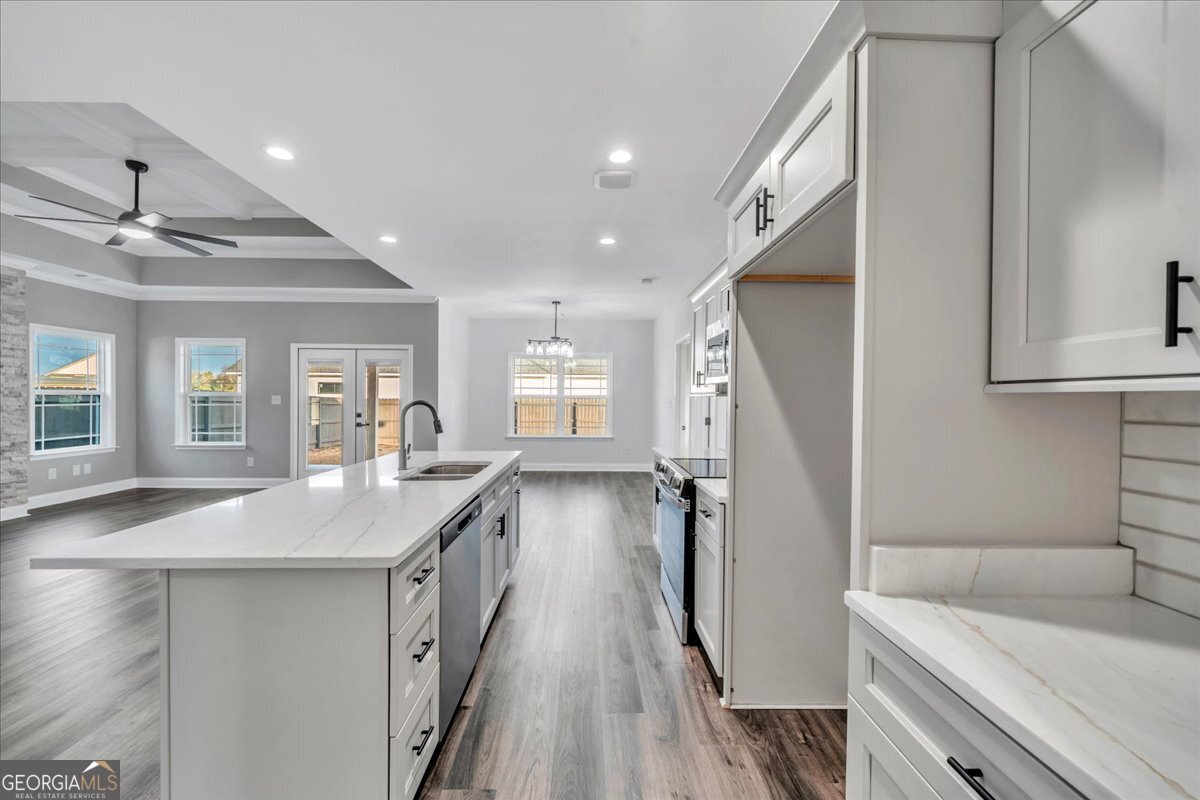 202 Eric Court Byron, GA 31008 - Photo 18 of 44 a bathroom with a granite countertop sink a toilet a shower and a mirror