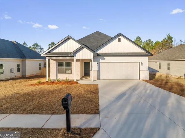 a front view of a house with yard