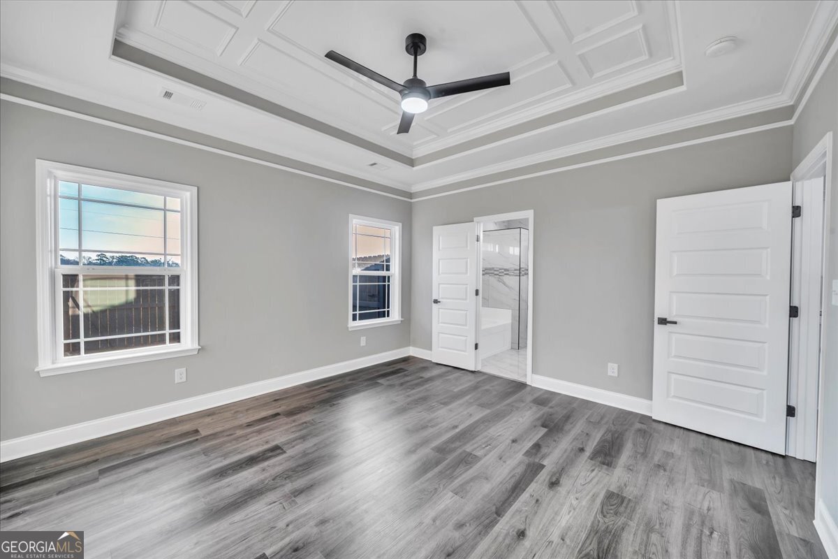 202 Eric Court Byron, GA 31008 - Photo 22 of 44 wooden floor in an empty room with a window