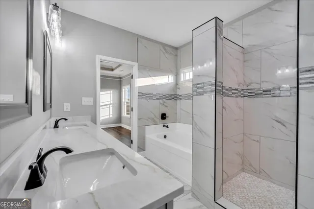 a bathroom with a bathtub and a shower