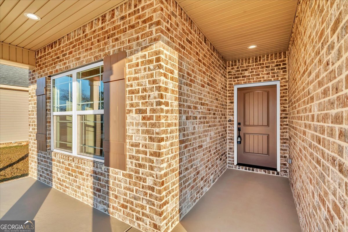 202 Eric Court Byron, GA 31008 - Photo 3 of 44 front view of a brick house