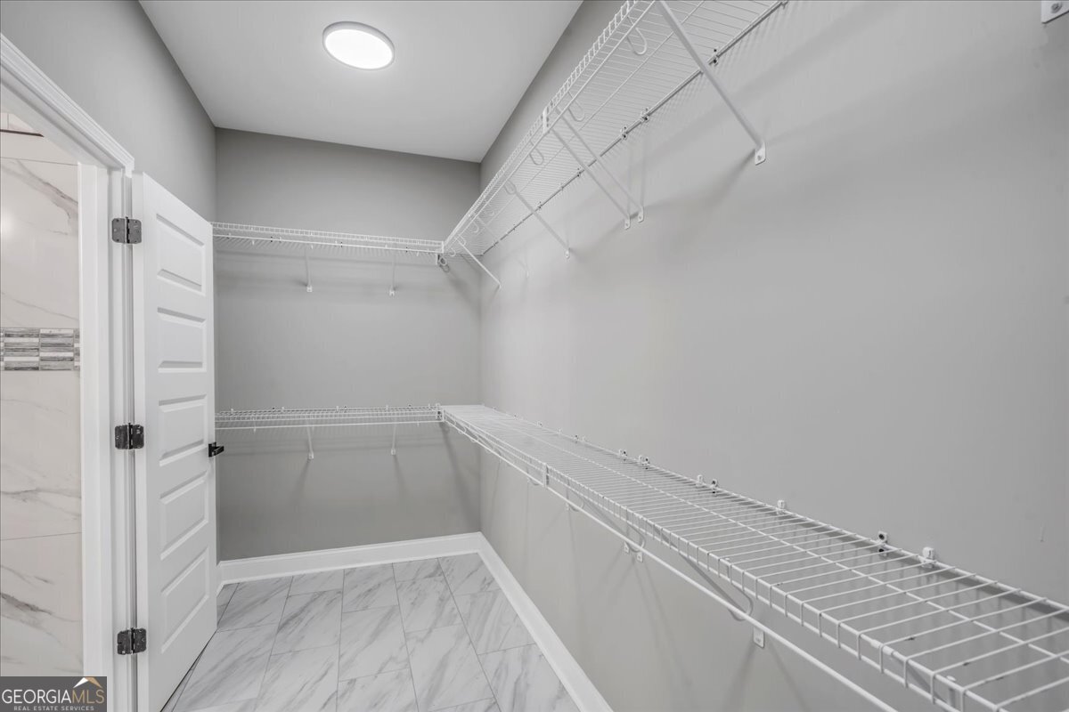 202 Eric Court Byron, GA 31008 - Photo 31 of 44 a view of a room with racks on the wall