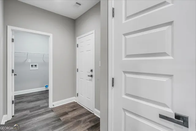 a view of bathroom with wooden floor