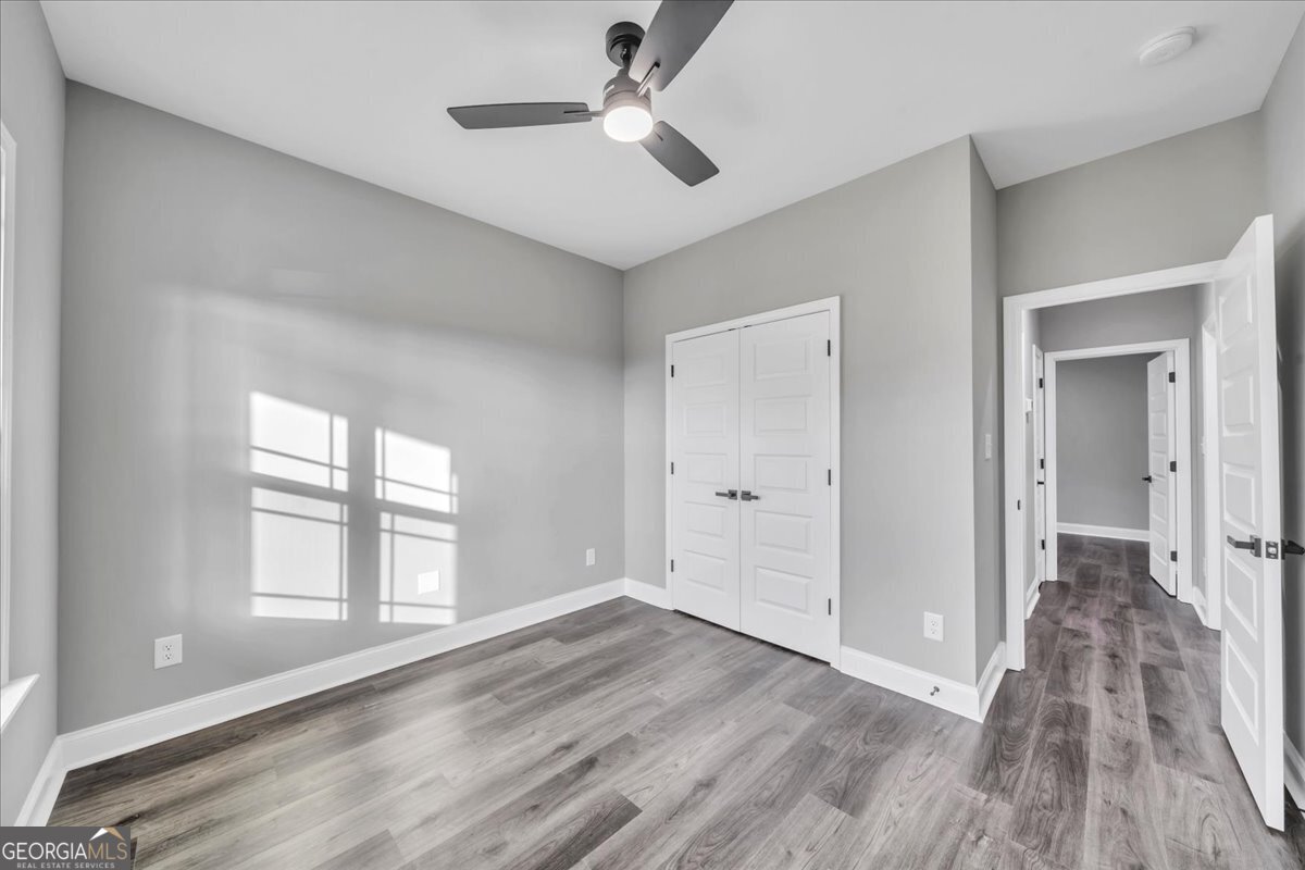 202 Eric Court Byron, GA 31008 - Photo 35 of 44 wooden floor in an empty room with a window