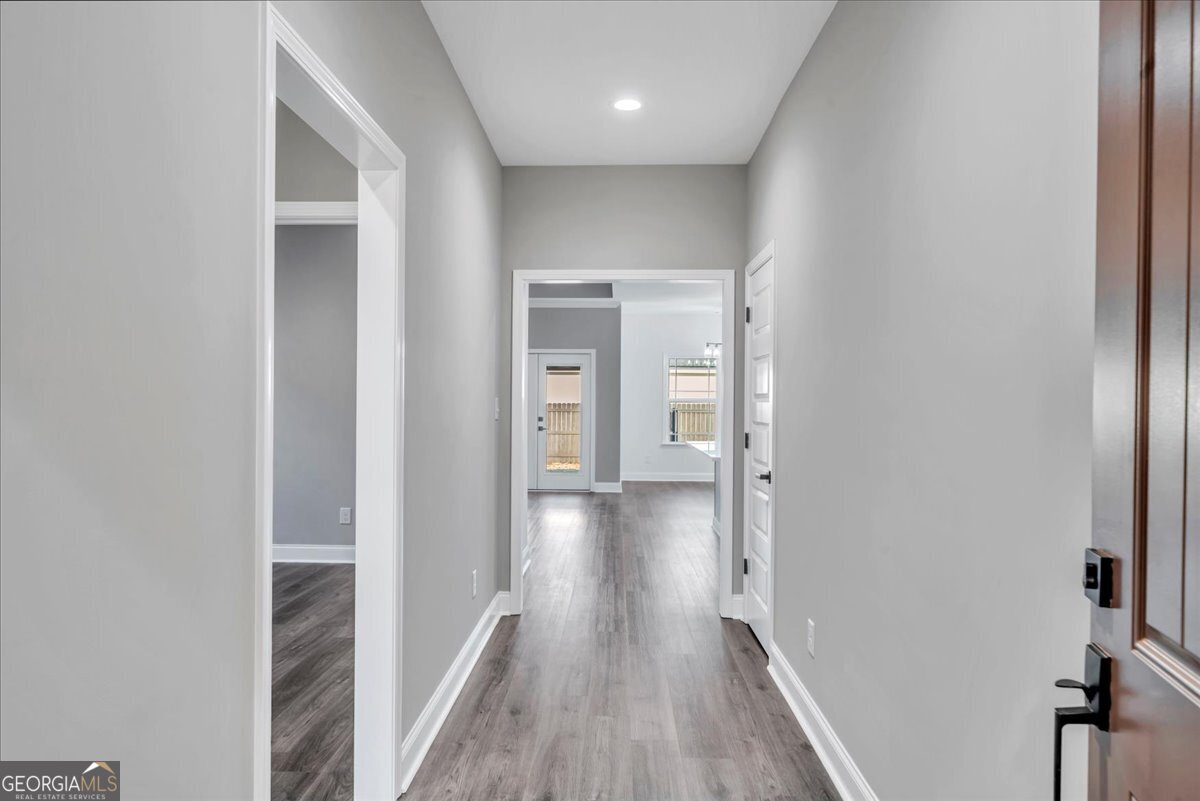 202 Eric Court Byron, GA 31008 - Photo 4 of 44 a view of hallway with wooden floor
