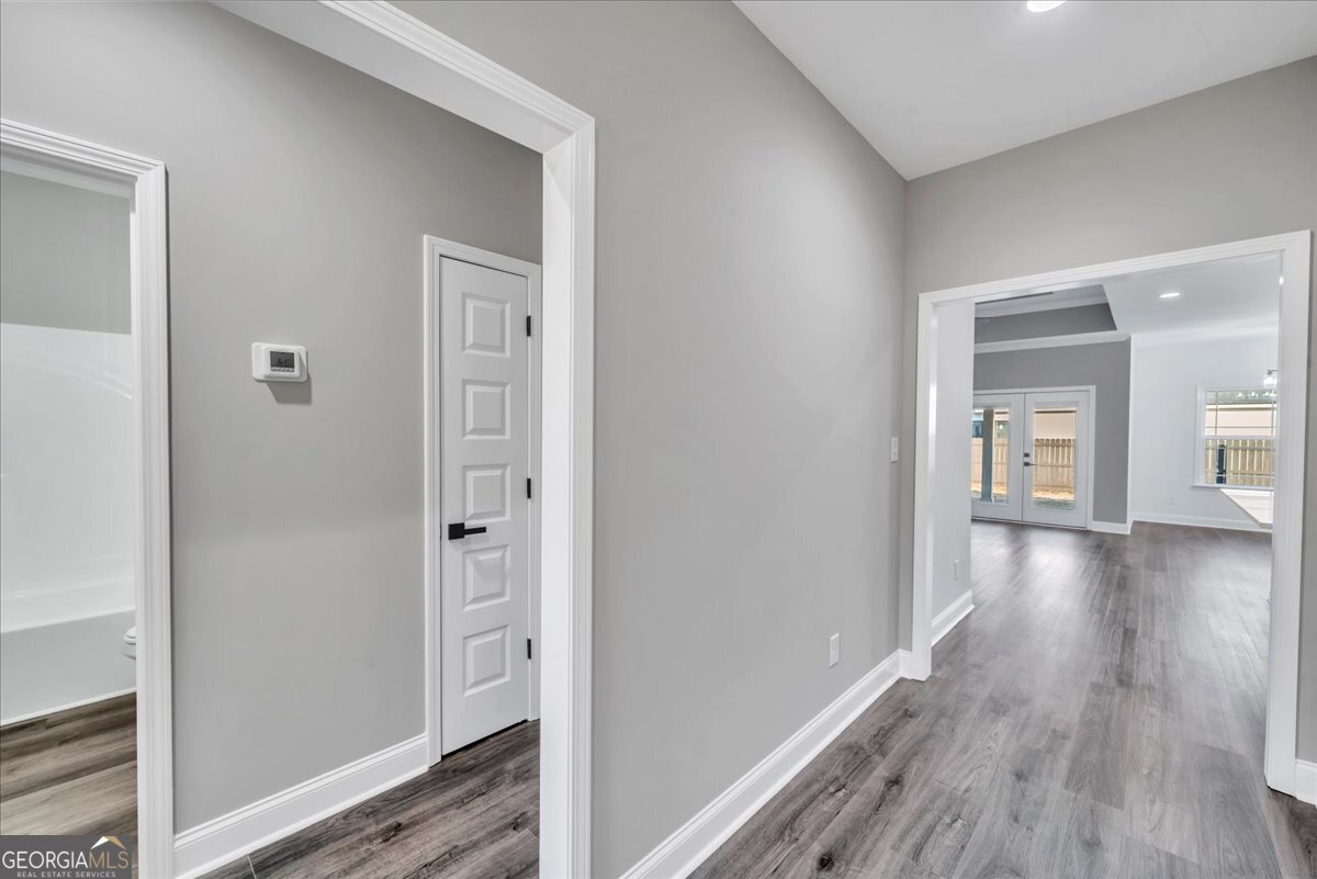 202 Eric Court Byron, GA 31008 - Photo 5 of 44 a view of a hallway with wooden floor