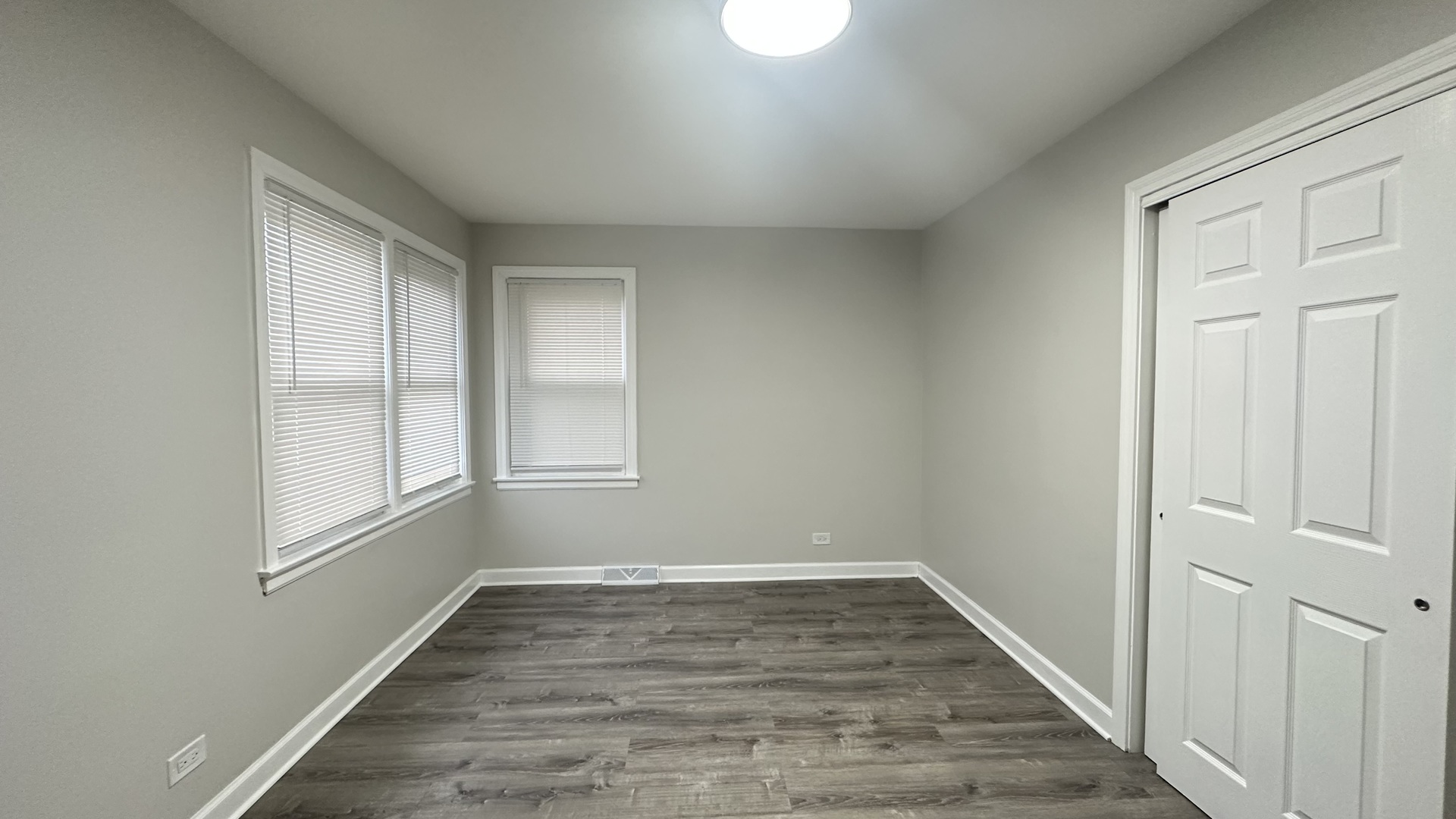 5715 North Spaulding Avenue, Unit 1 Chicago, IL 60659 - Photo 14 of 15 wooden floor in an empty room with a window