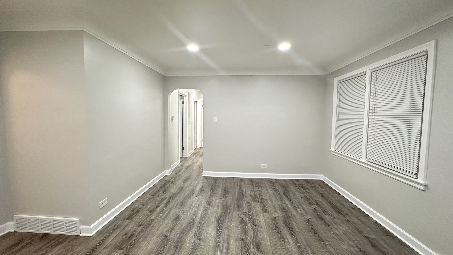 5715 North Spaulding Avenue, Unit 1 Chicago, IL 60659 - Photo 4 of 15 a view of room with window and wooden floor