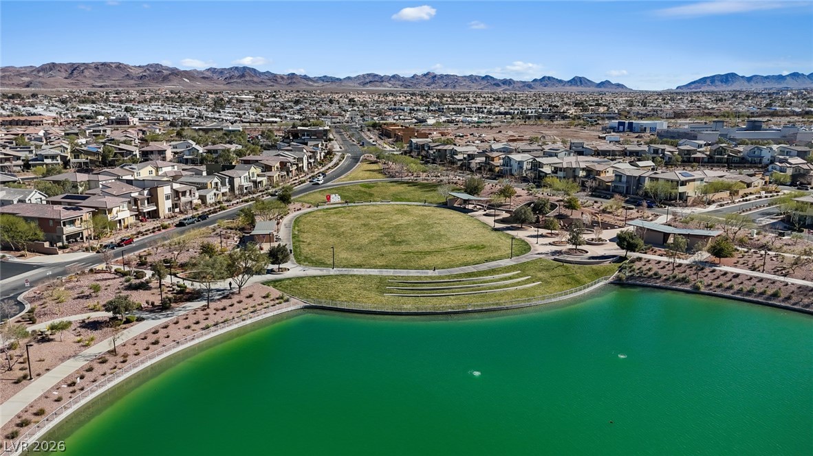 250 Dedication Avenue Henderson, NV 89011 - Photo 56 of 67 Aerial overview of property's location with nearby suburban area and a water and mountain view