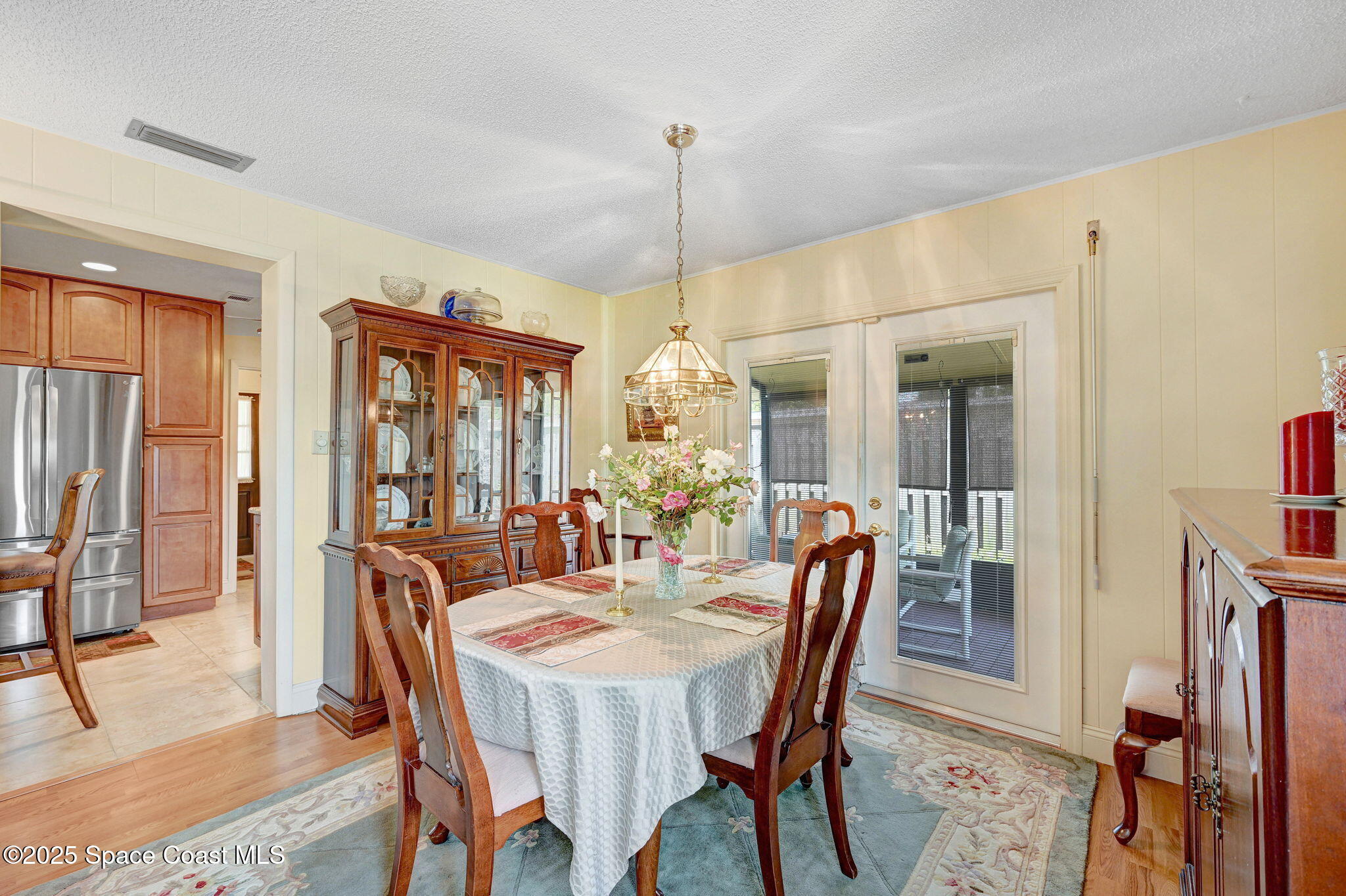 1208 Duke Way Cocoa, FL 32922 - Photo 14 of 34 a dining room with furniture window and wooden floor