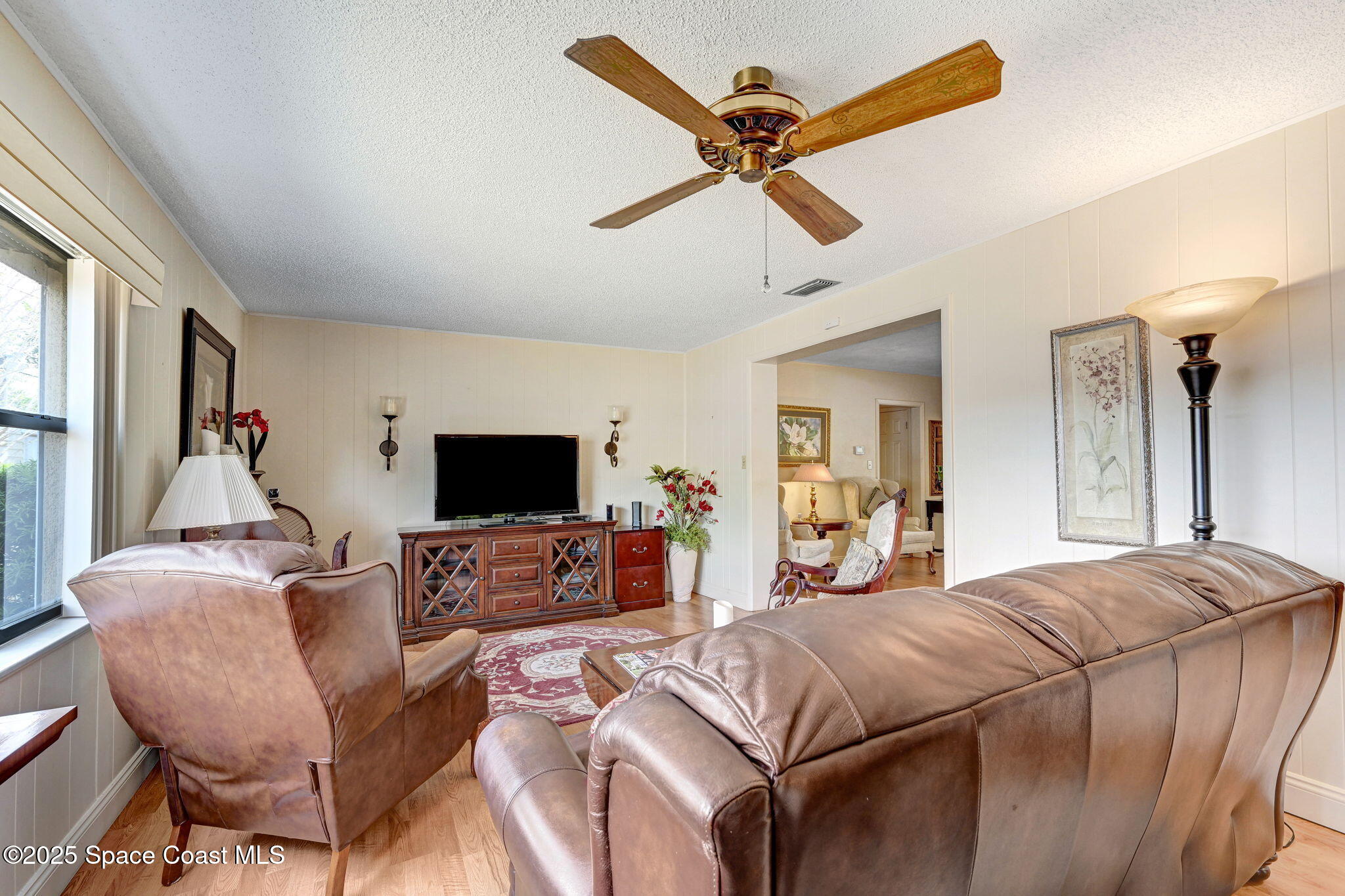 1208 Duke Way Cocoa, FL 32922 - Photo 15 of 34 a bedroom with a bed and furniture