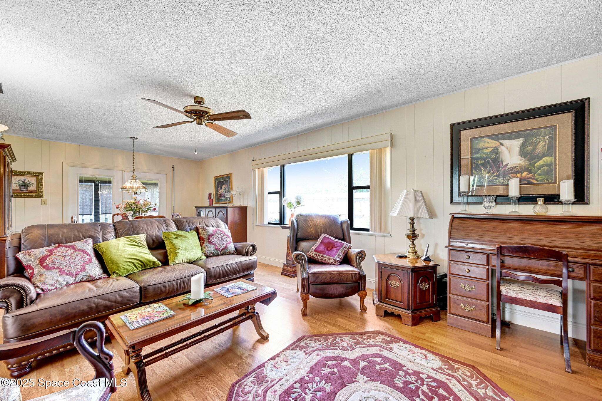 1208 Duke Way Cocoa, FL 32922 - Photo 17 of 34 a living room with furniture a dining table and a piano table