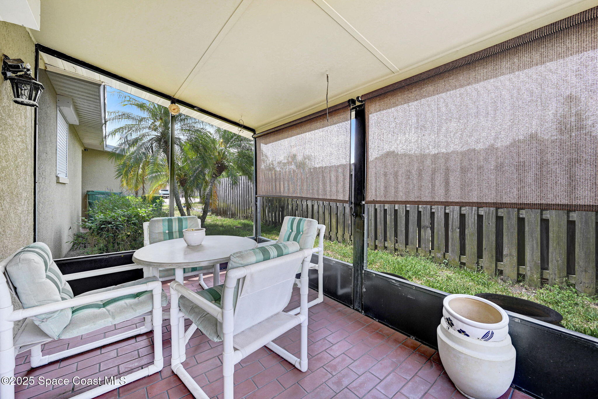 1208 Duke Way Cocoa, FL 32922 - Photo 19 of 34 a view of a patio with a dining table and chairs