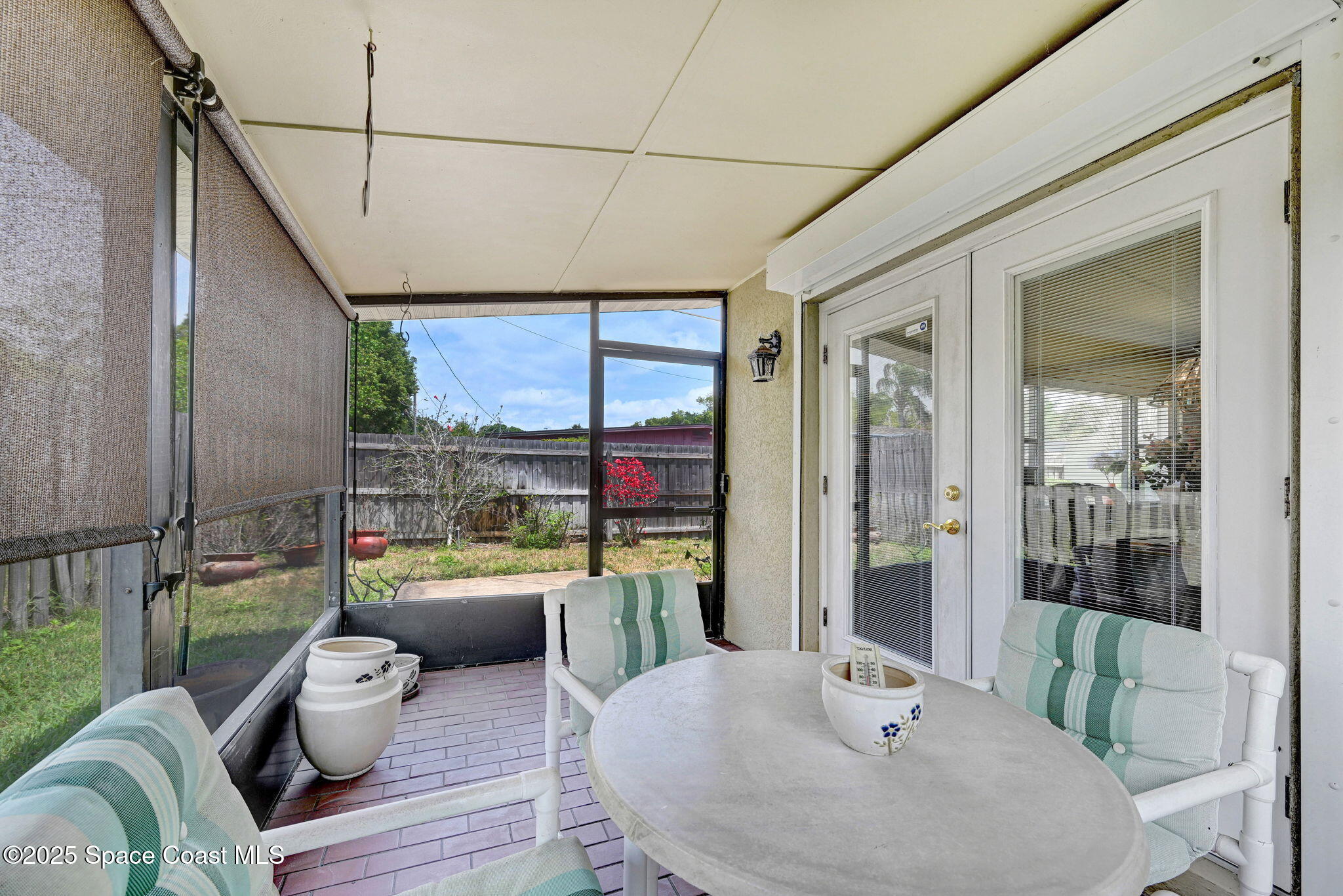 1208 Duke Way Cocoa, FL 32922 - Photo 20 of 34 a living room with furniture and a floor to ceiling window