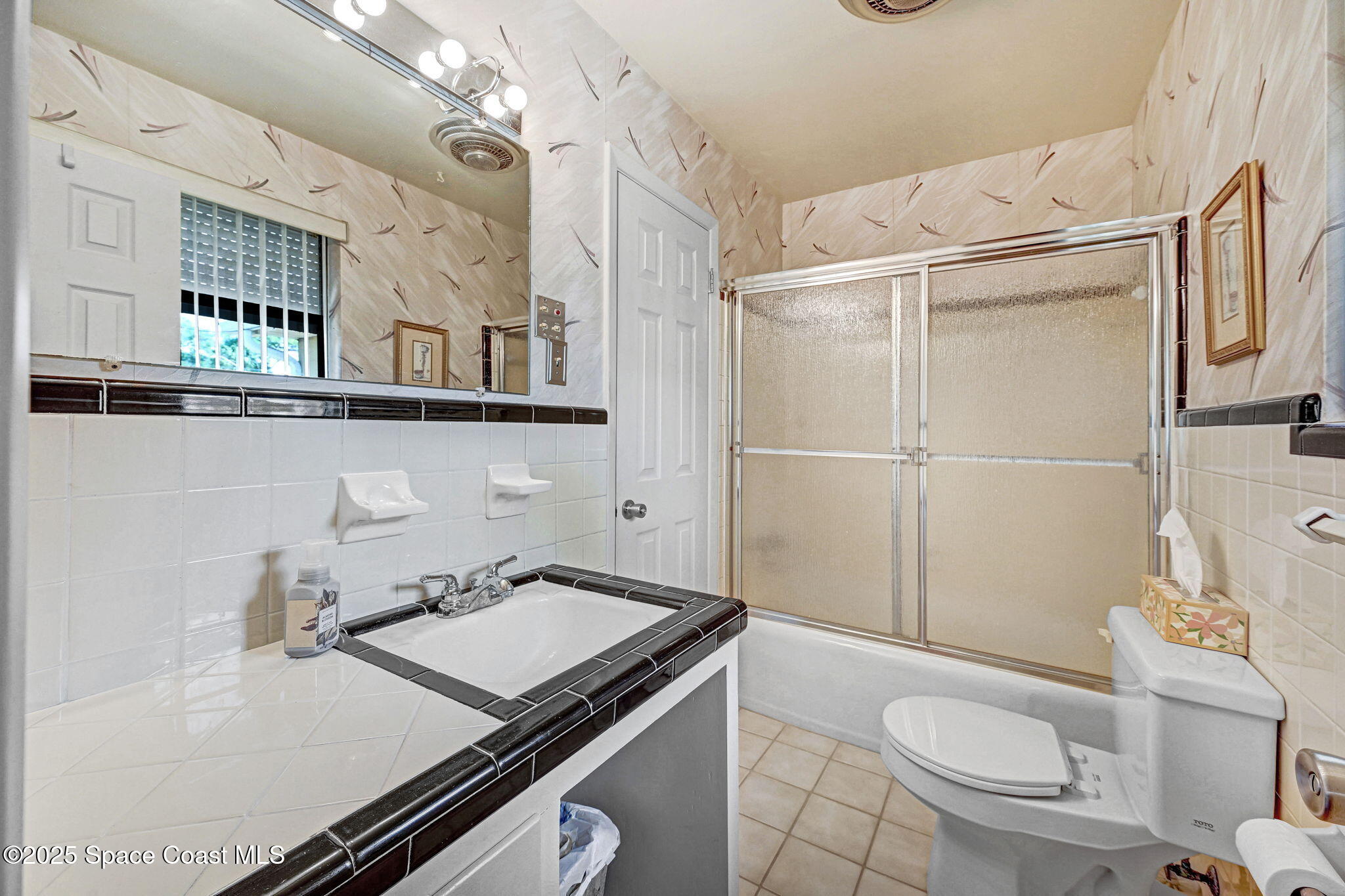 1208 Duke Way Cocoa, FL 32922 - Photo 22 of 34 a bathroom with a sink a toilet a mirror and shower