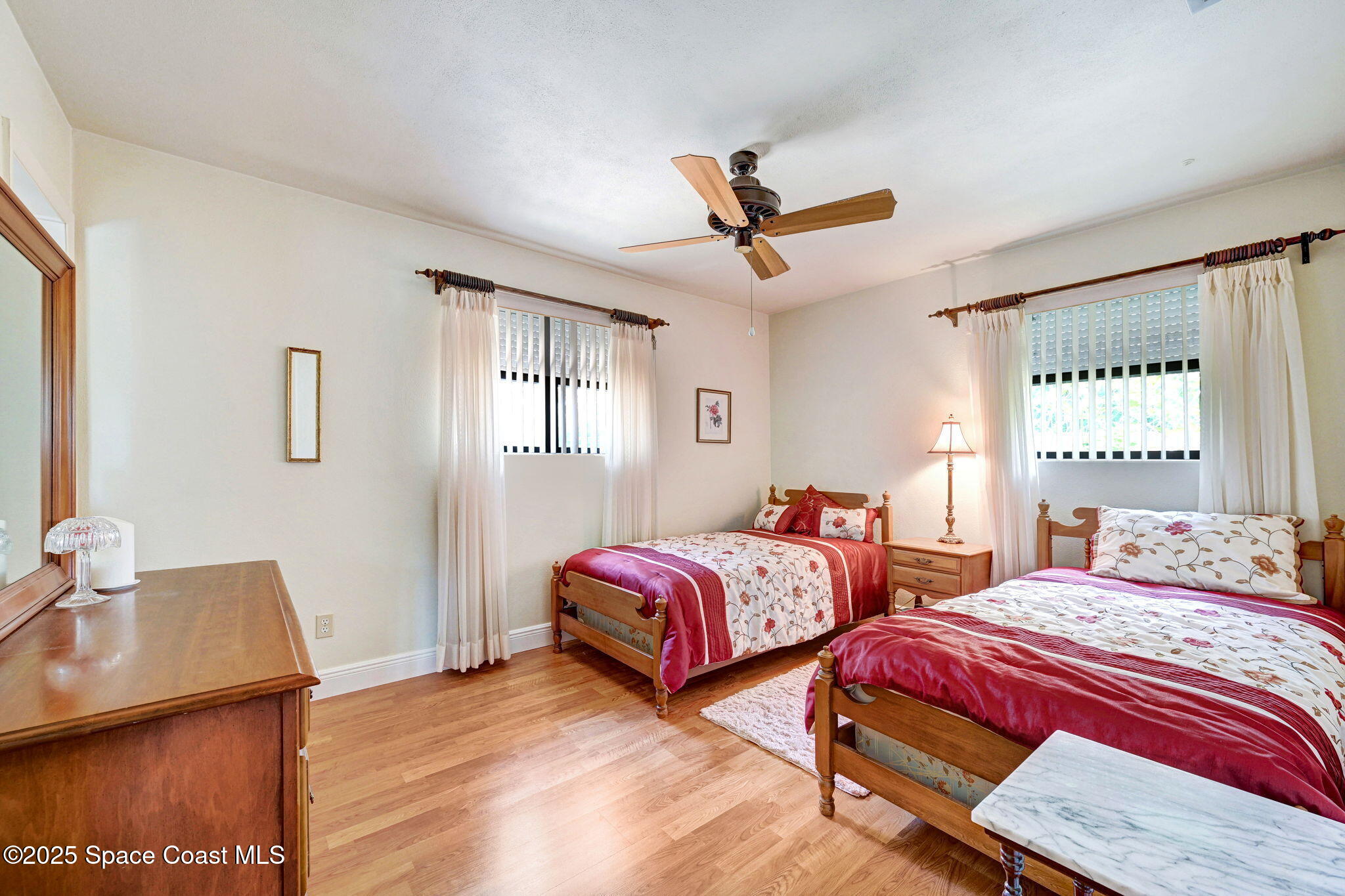 1208 Duke Way Cocoa, FL 32922 - Photo 26 of 34 a bedroom with two beds and a window