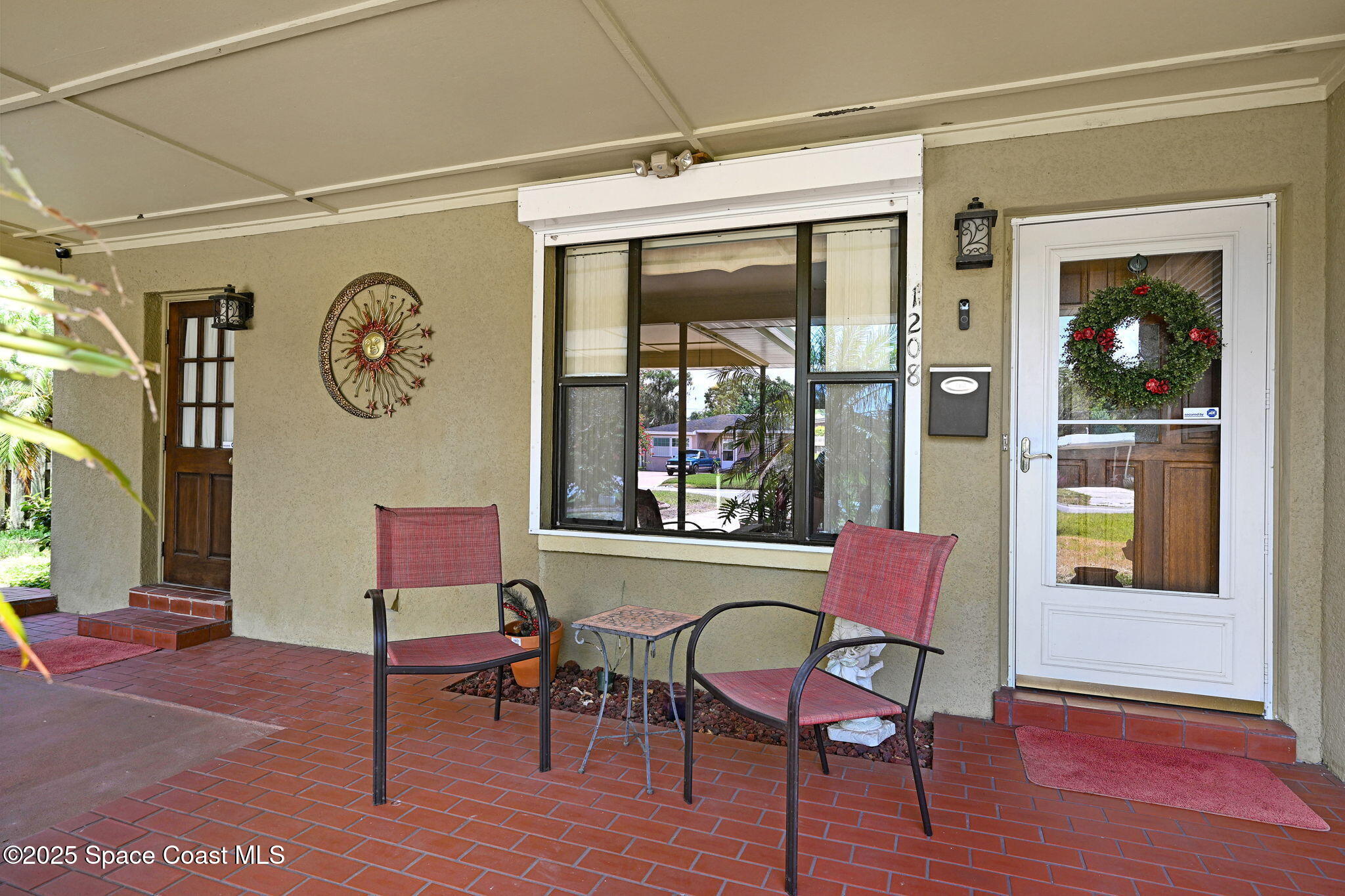 1208 Duke Way Cocoa, FL 32922 - Photo 28 of 34 a view of a dining room with furniture window and wooden floor
