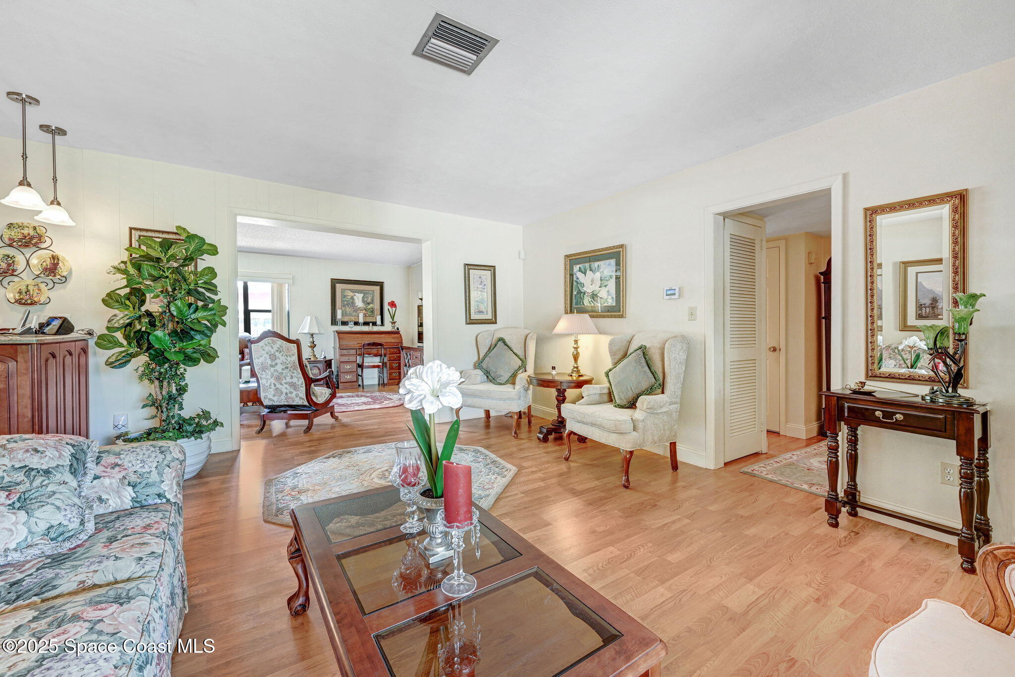 1208 Duke Way Cocoa, FL 32922 - Photo 5 of 34 a living room with furniture hard wood floor and a table