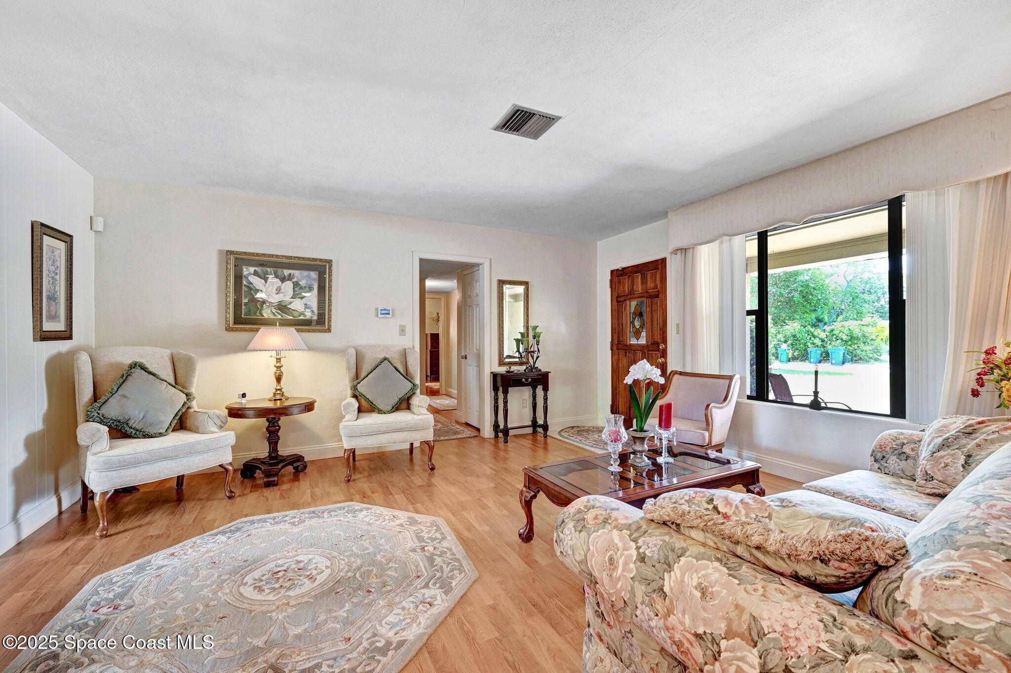 1208 Duke Way Cocoa, FL 32922 - Photo 8 of 34 a living room with furniture and large windows